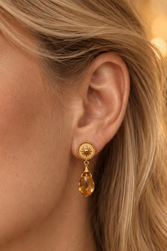 Aros de acero dorado con cristal ámbar