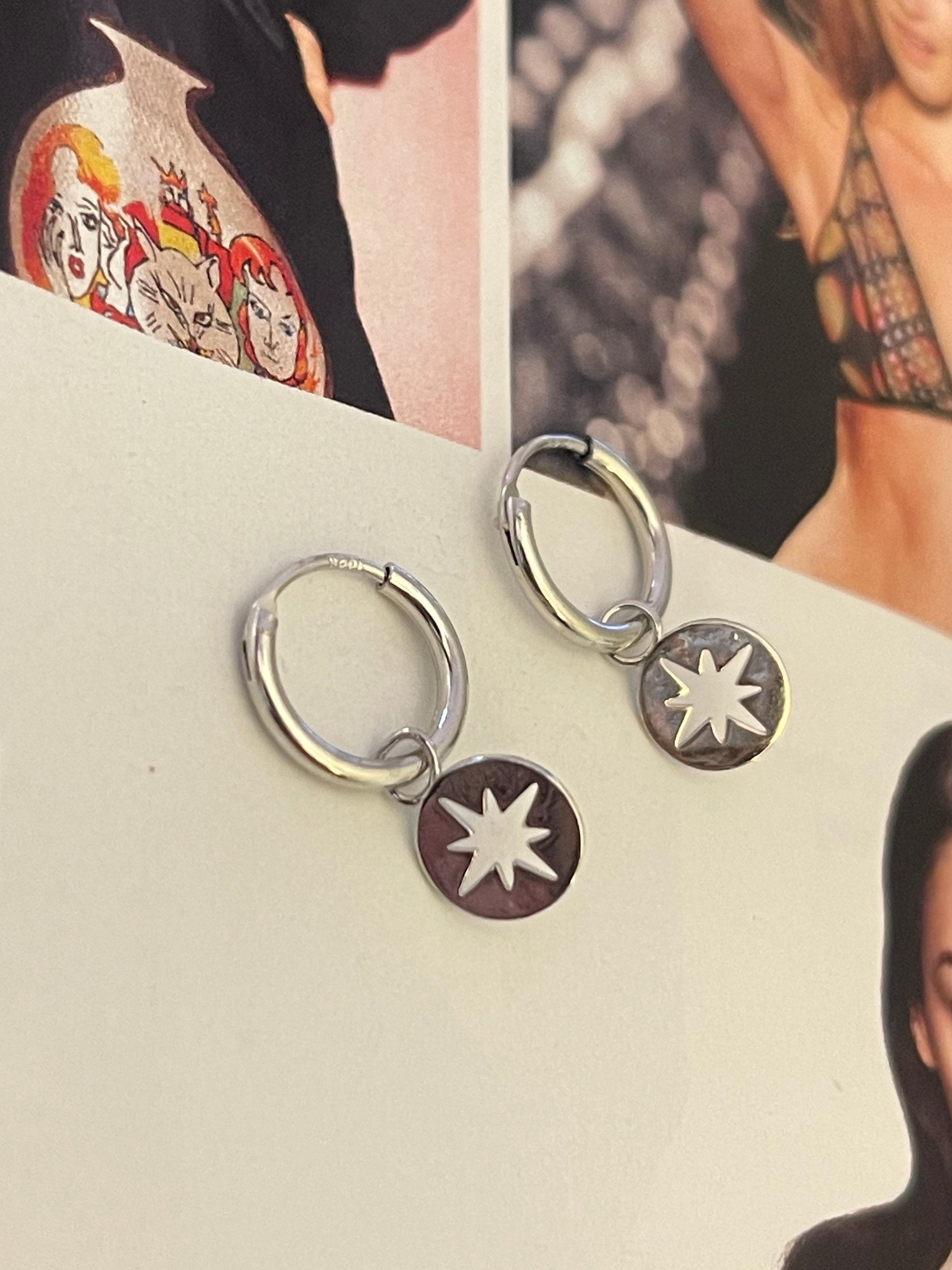 Aros Hippie Chic tipo argollas bañados en plata con preciosa estrella del norte. Largo 2 cm.